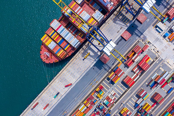 Aerial,View,Of,International,Containers,Cargos,Ship,In,The,Blue